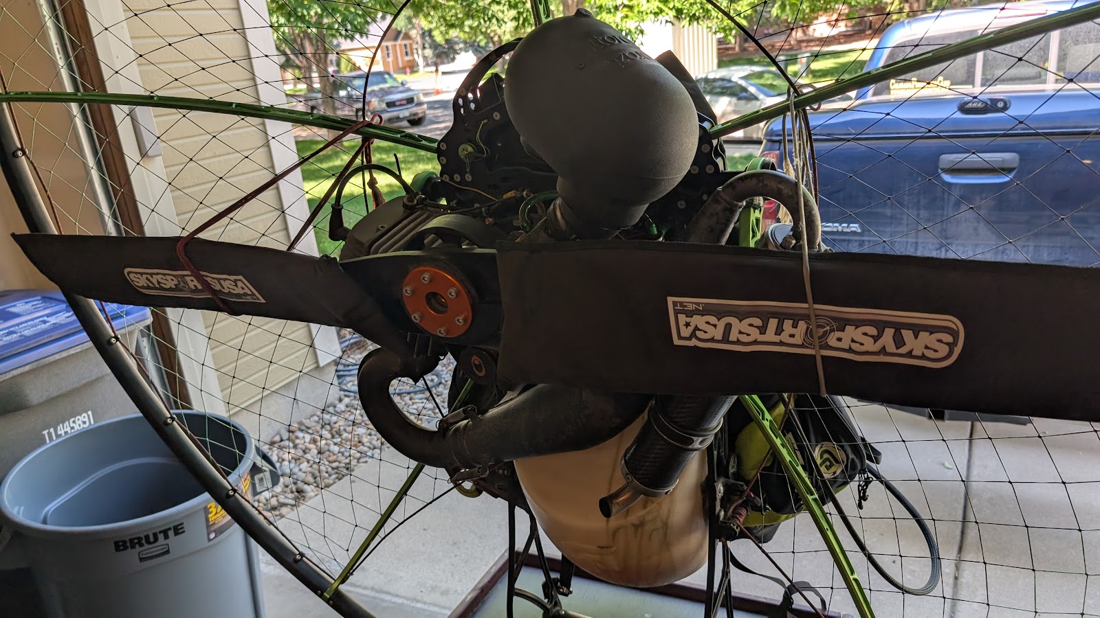A powered paraglider motor in the shop for its 100-hour service